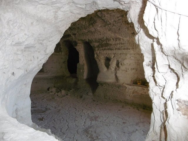 Cave house interior in Benamaurel, Granada, showcasing natural rock formations and unique living spa.