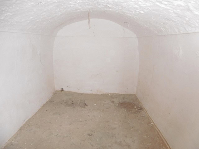 Traditional cave house interior in Benamaurel, Granada, showcasing rustic charm and unique architect.