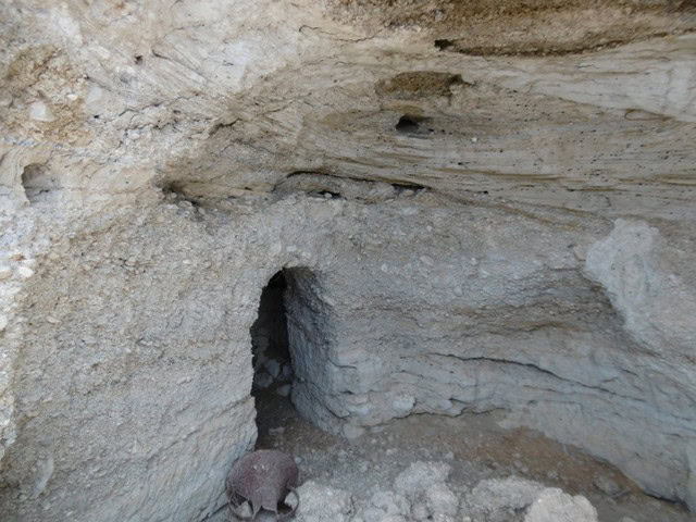 Cave house entrance in Benamaurel, Granada, built into natural rock formations.