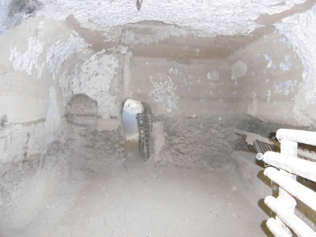 Cave house interior in Benamaurel, Granada, showcasing traditional underground living space.