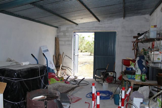 Rural property in Lucar, Almeria, with a spacious interior and open door leading to the countryside.