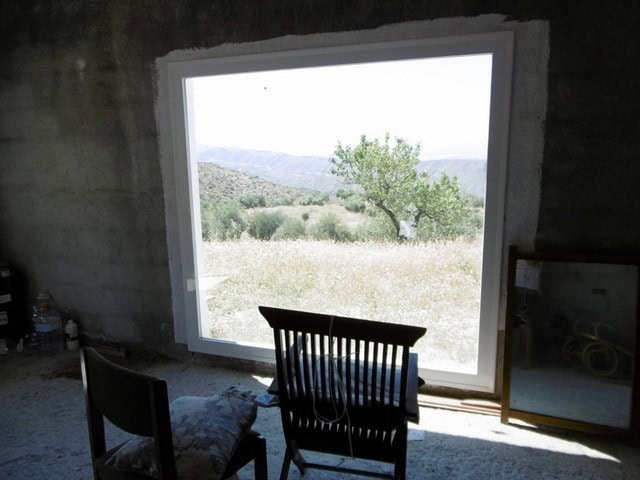 Scenic view of countryside from a rural property in Sufli, Almeria, with open fields and a distant m.