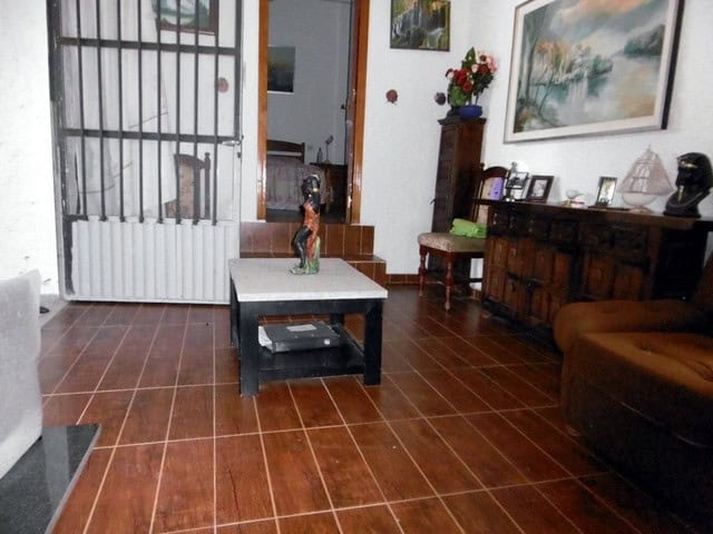 Interior view of a rural property in Sufli, Almeria, showcasing a warm and inviting living space wit.