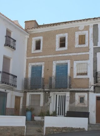 Charming town house in Seron, Almeria with rustic exterior and balconies. Perfect for renovation or.