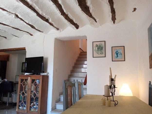 Charming interior of a village property in Hinojares, Jaen, featuring rustic ceiling beams and cozy.