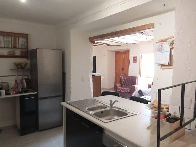 Charming village home in Hinojares, Jaen, featuring a cozy kitchen and inviting living space. Perfec.