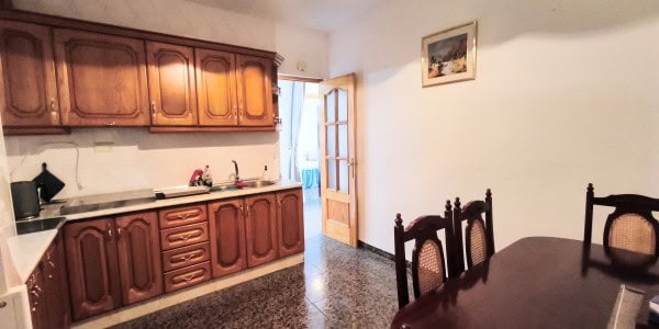 Interior view of a traditional village kitchen in Villanueva de las To, Granada, featuring wooden ca.