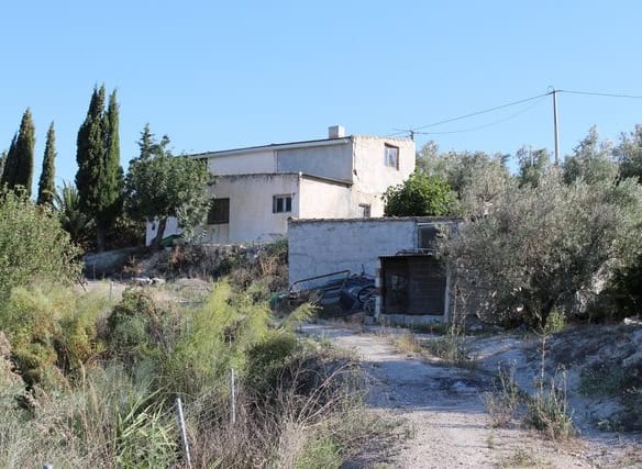 Rural property in Tijola, Almeria, featuring a traditional house surrounded by natural landscape and.