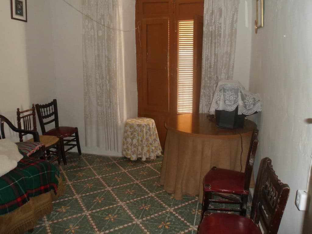 Charming interior of a village property in Cullar, Granada, featuring traditional furniture and cozy.