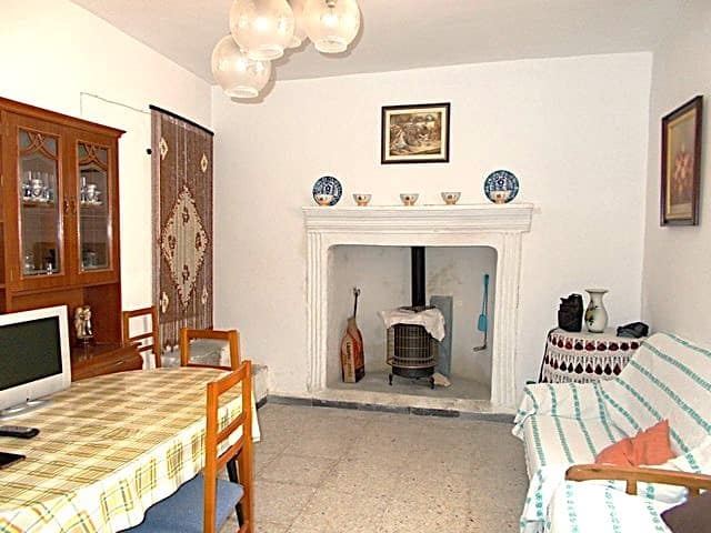 Charming village property in Hijate, Almeria, featuring a traditional fireplace and inviting living.