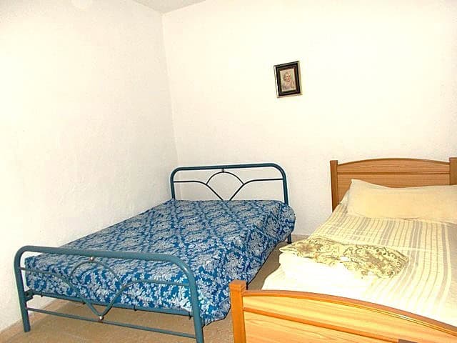 Village property bedroom with two beds in Hijate, Almeria, Spain.