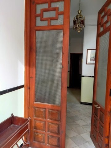 Traditional wooden door with intricate design in Cullar, Granada.
