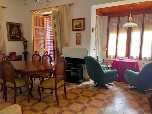 Charming town house living room in Cullar, Granada with traditional furniture and bright natural lig.