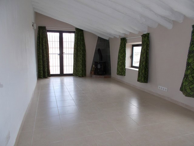 Village property interior with spacious living area and traditional features in Cela, Almeria.