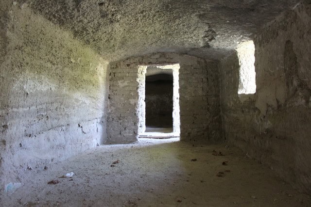Cave house interior in Caniles, Granada, showcasing natural stone walls and unique underground livin.