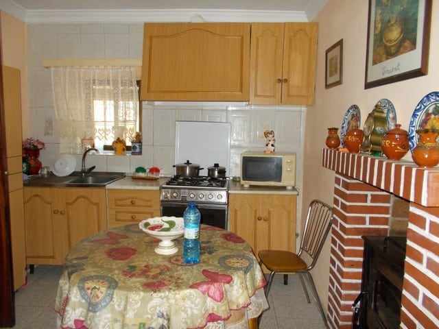 Charming kitchen in a rural property in Seron, Almeria, featuring traditional wooden cabinets and co.