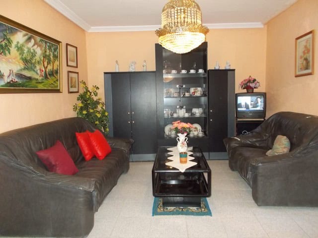 Spacious living room in a rural property in Seron, Almeria, featuring comfortable sofas, a chandelie.