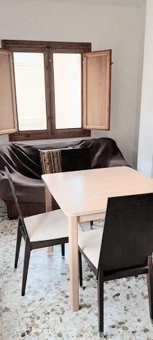 Bright interior with wooden window shutters in Zujar, Granada. Perfect for a comfortable living spac.
