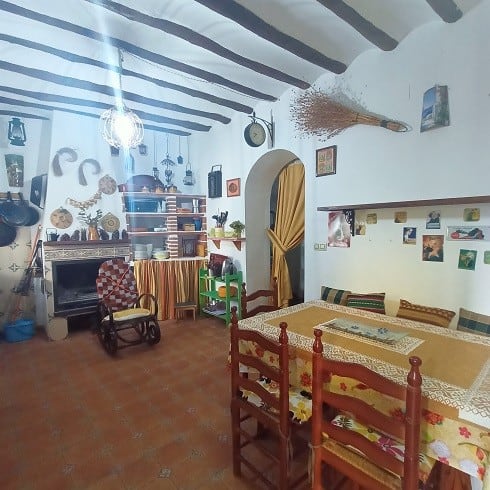 Charming interior of a village property in Fontanar, Jaen, featuring rustic decor and traditional fu.