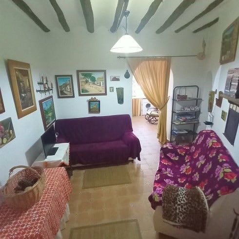 Cozy interior of a village property in Fontanar, Jaen, featuring traditional decor and inviting livi.