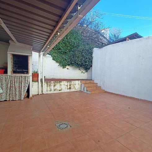 Charming outdoor patio of a village property in Fontanar, Jaen, with terracotta tiles, stairs, and s.