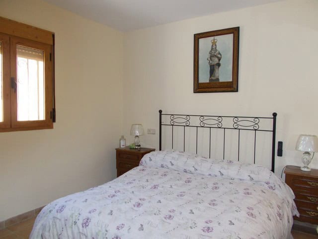 Rural property in Seron, Almeria with a cozy bedroom and traditional decor. Perfect for those seekin.