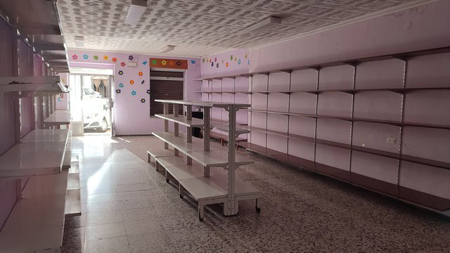 Interior view of a commercial space with shelves and display areas in Seron, Almeria.