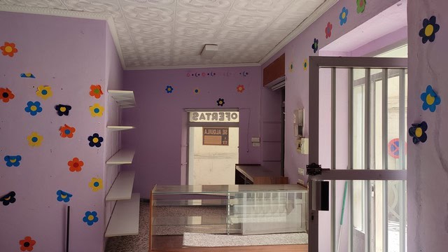 Commercial property for sale in Seron, Almeria, featuring a colorful interior with floral wall decor.