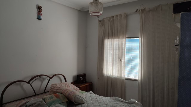 Bright bedroom with window and curtains in Caniles, Granada.