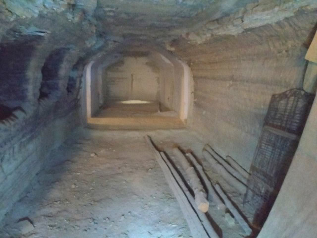 Cave house interior in Benamaurel, Granada, showcasing historic stone walls and tunnel-like structur.