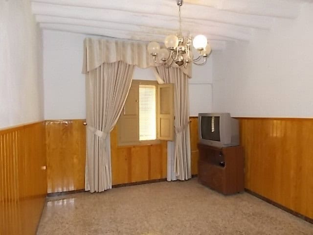 Village property with traditional interior in Somontin, Almeria, featuring wooden paneling and vinta.