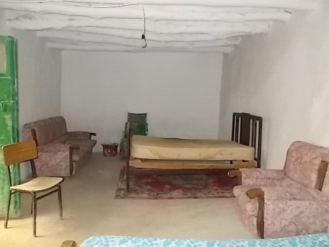 Rural property interior in Tijola, Almeria with simple furnishings and rustic charm.