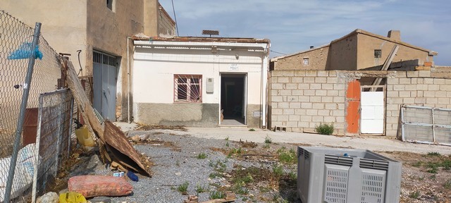 Rural property for sale in Tijola, Almeria, featuring a small, traditional house with outdoor space.