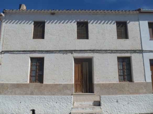 Charming village house in Campo Camara, Granada, with traditional architecture and rustic appeal.