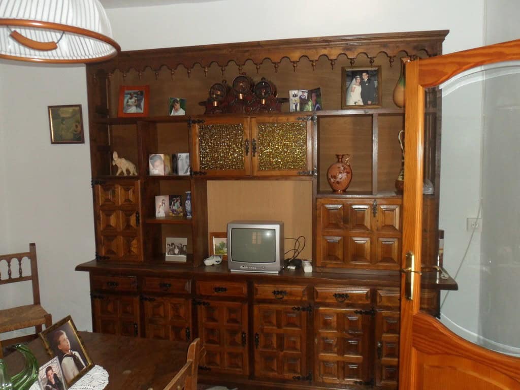 Charming village home in Campo Camara, Granada, featuring traditional wooden furniture and cozy deco.