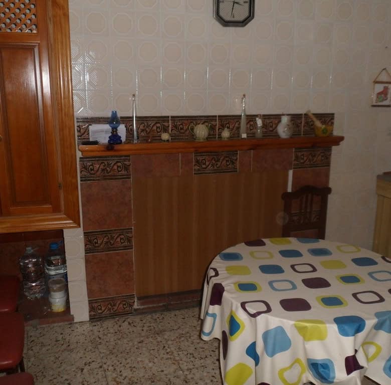 Charming village property in Campo Camara, Granada, featuring a cozy interior with wooden furniture.
