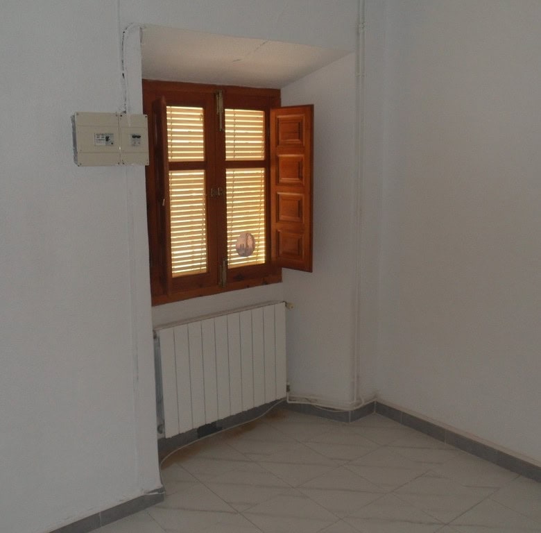 Cozy village property with wooden window shutters in Campo Camara, Granada. Ideal for renovation or.