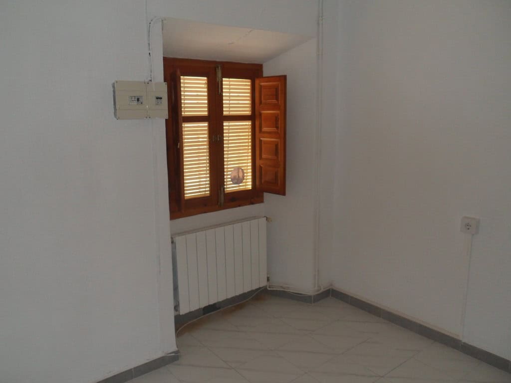 Cozy village property with wooden window shutters in Campo Camara, Granada. Ideal for renovation or.