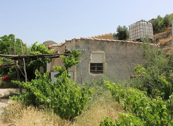 Charming rural property in Lucar, Almeria, surrounded by lush greenery and scenic landscape.