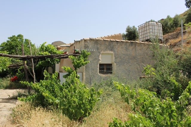 Charming rural property in Lucar, Almeria, surrounded by lush greenery and scenic landscape.
