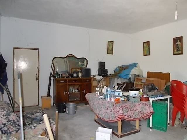 Charming rural property interior in Lucar, Almeria, featuring basic furnishings and a cozy, lived-in.