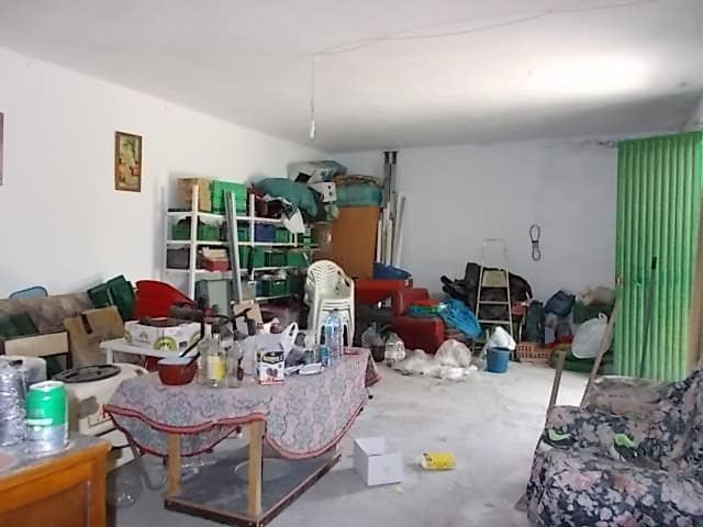Spacious interior of a rural property in Lucar, Almeria, filled with furniture, household items, and.