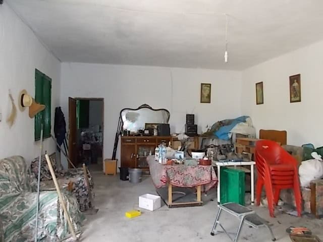 Charming rural home interior in Lucar, Almeria, featuring simple furnishings and a cozy, lived-in at.