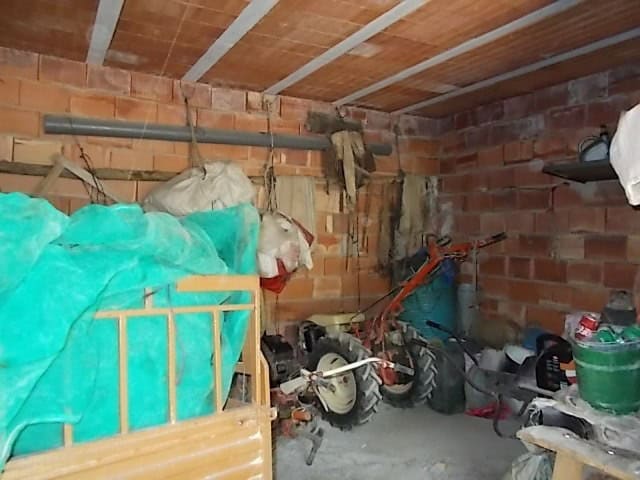 Rural property interior with tools and storage items in Lucar, Almeria.