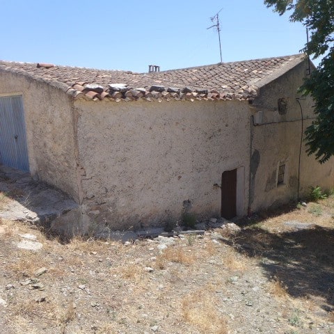 Traditional village house in Chirivel, Almeria with rustic exterior and tiled roof. Ideal for renova.