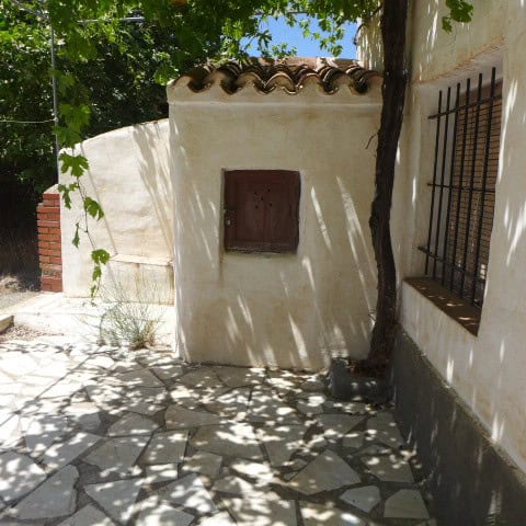 Chirivel village property with traditional white walls and shaded courtyard.