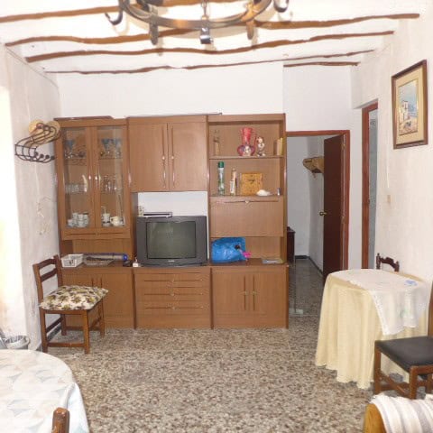 Chirivel village property interior with wooden furniture, vintage decor, and cozy living space in Al.