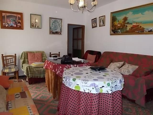 Charming interior of a rural property in Seron, Almeria, featuring traditional furniture and artwork.