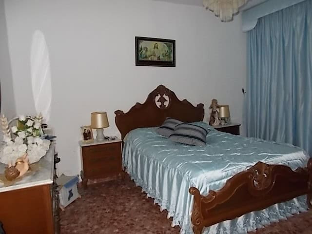 Charming bedroom in a rural property in Seron, Almeria, featuring traditional wooden furniture and c.