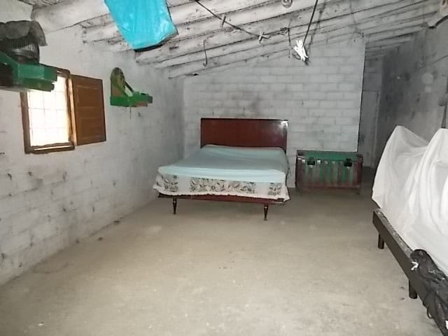 Traditional rural bedroom in Seron, Almeria with rustic charm and simple furnishings.